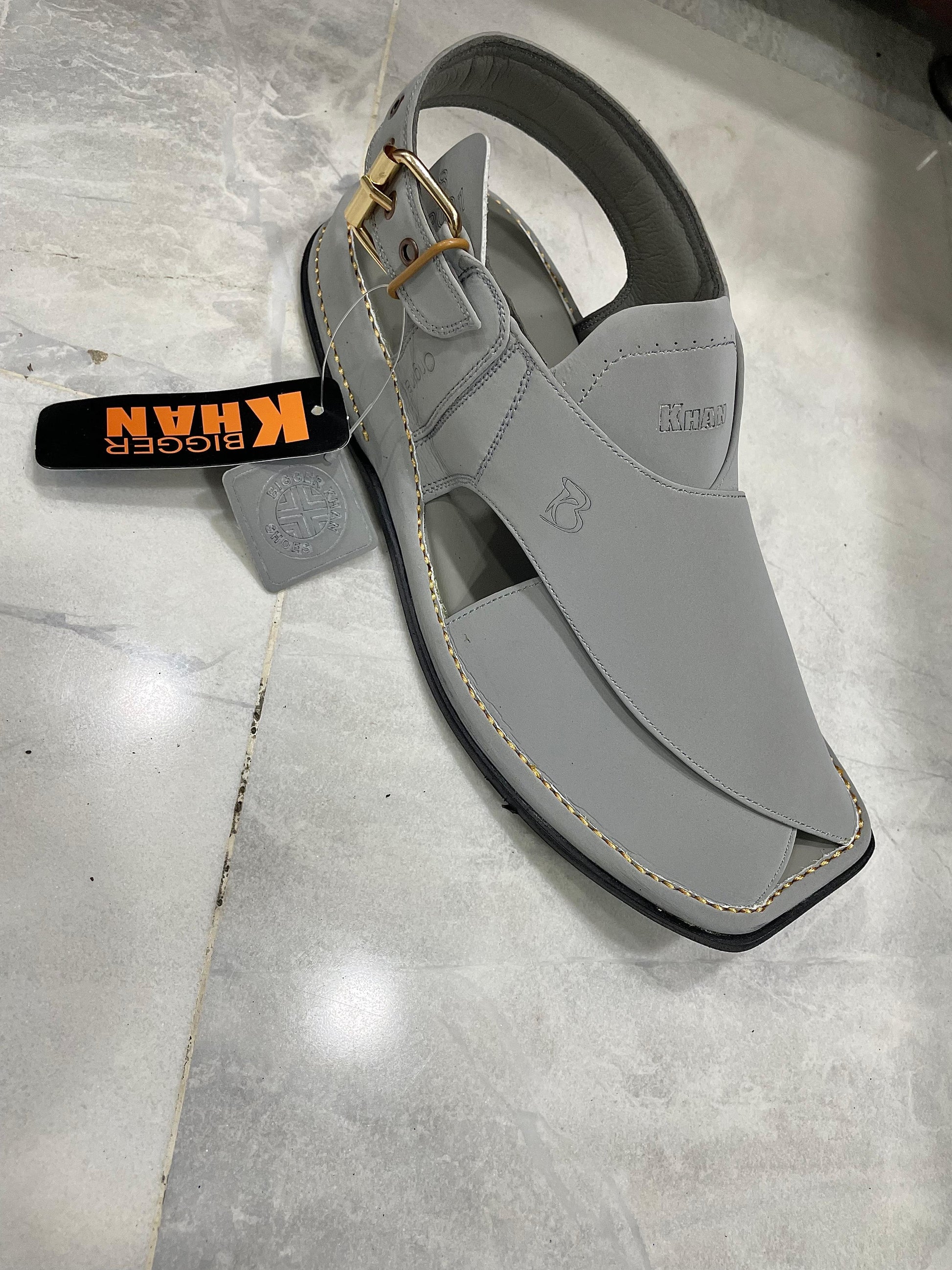 grey Peshawari chappal with a distinctive round shape